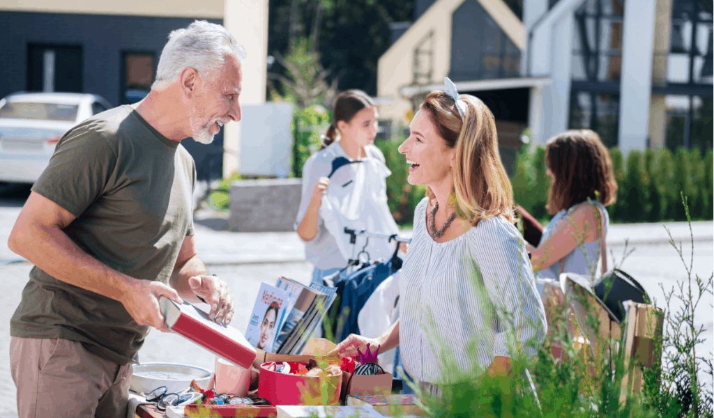 man and woman talking at a yard sale