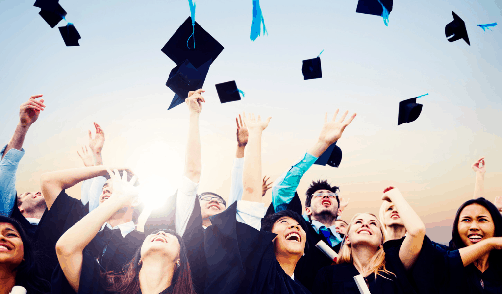 graduates throwing caps