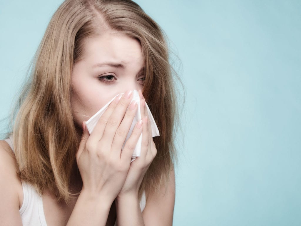 Flu Cold Or Allergy Symptom Sick Woman Girl Sneezing In Tissue On Blue Health Care