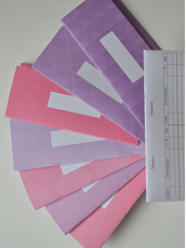 pink and purple cash envelopes with a blank one