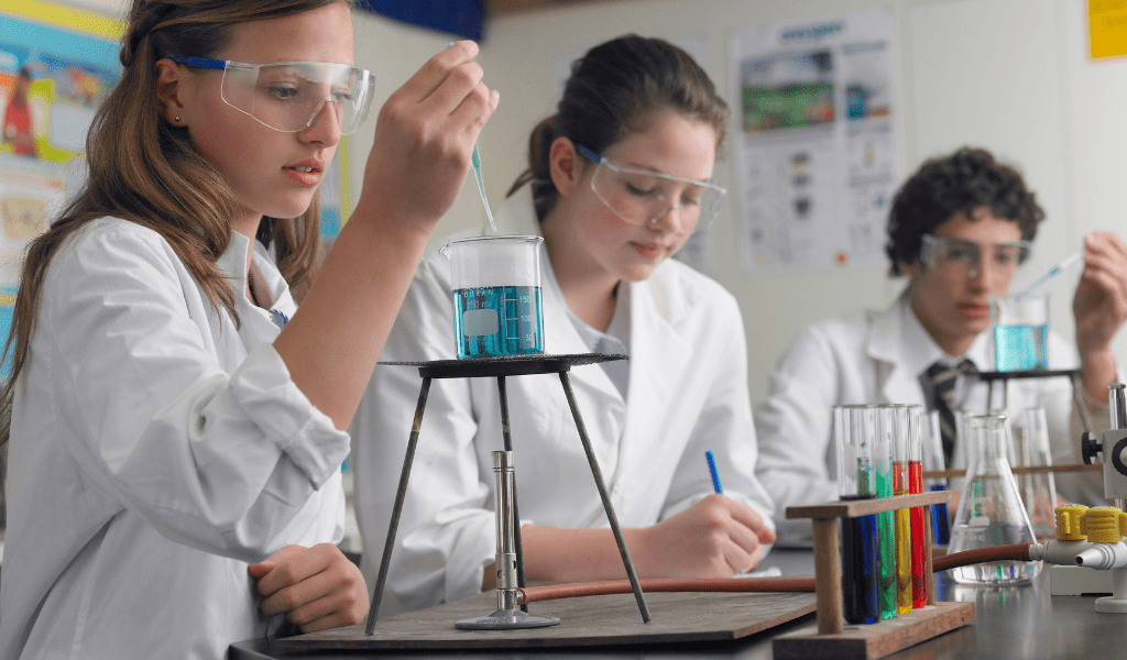 high school kids in chemistry class