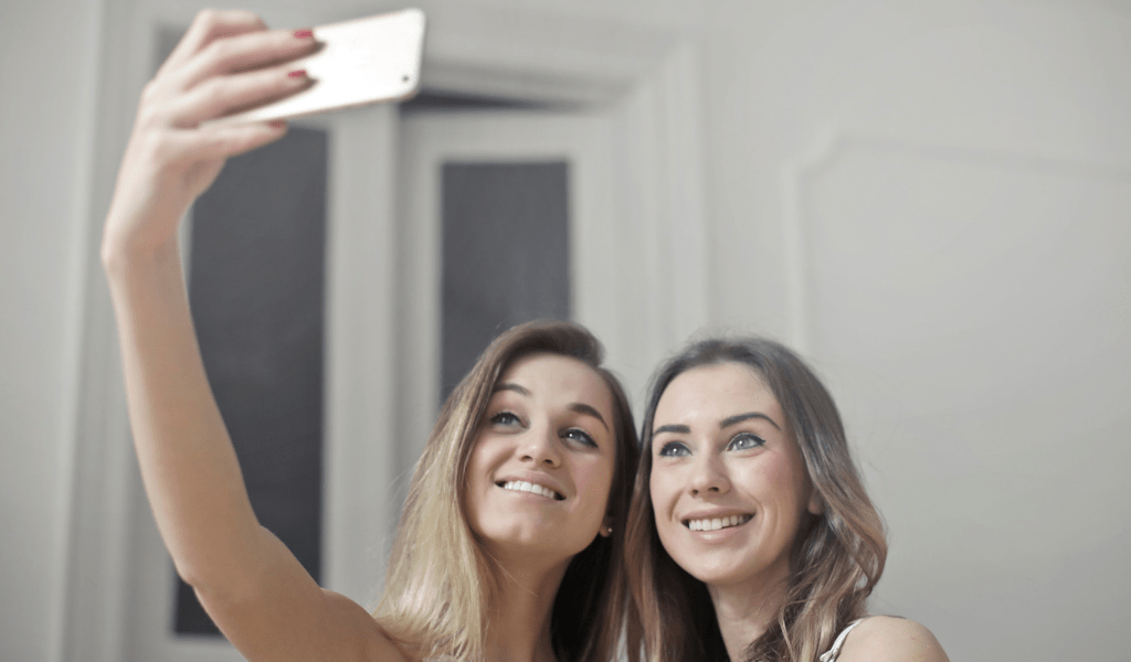 two girls taking a photo