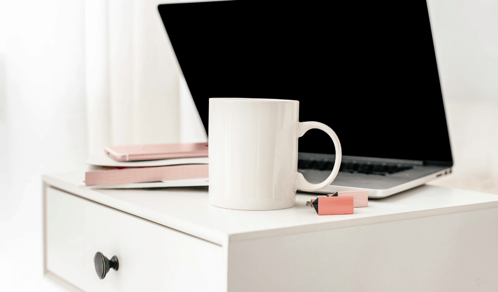desk with computer and mug