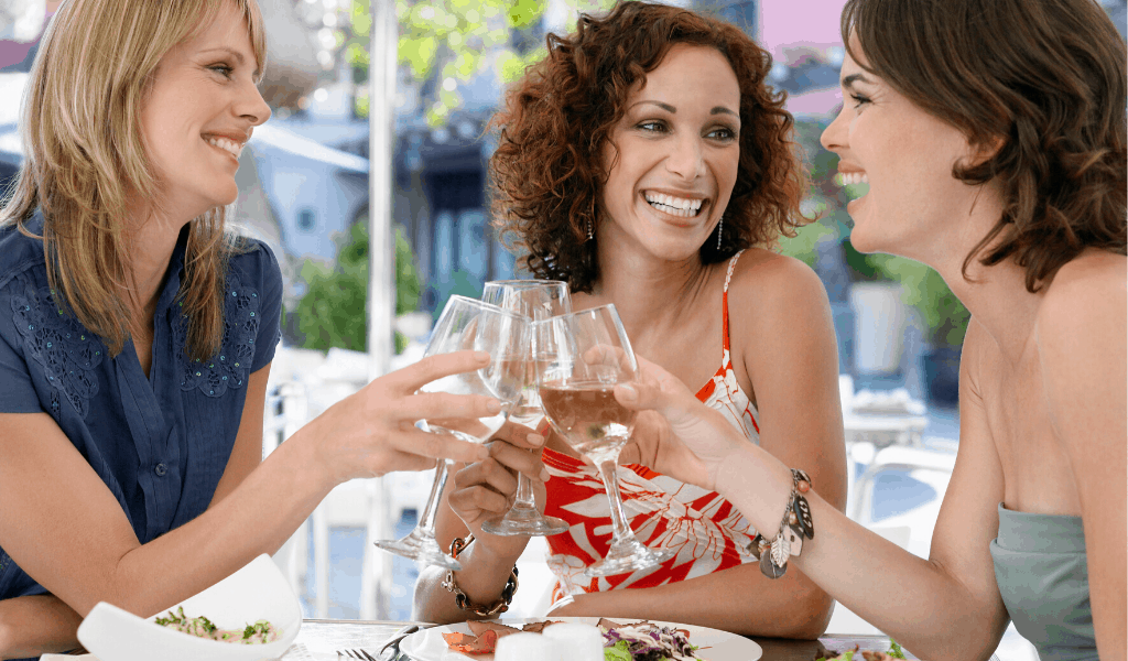 women drinking wine at a restaurant