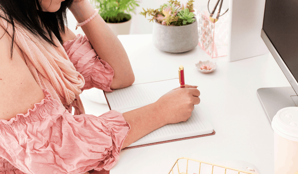 woman making a budgeting plan at her desk