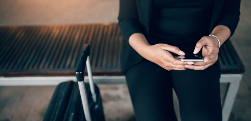 woman waiting at the airport for her uber driver