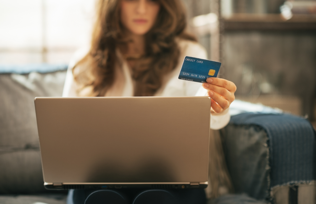 woman shopping on laptop with credit card