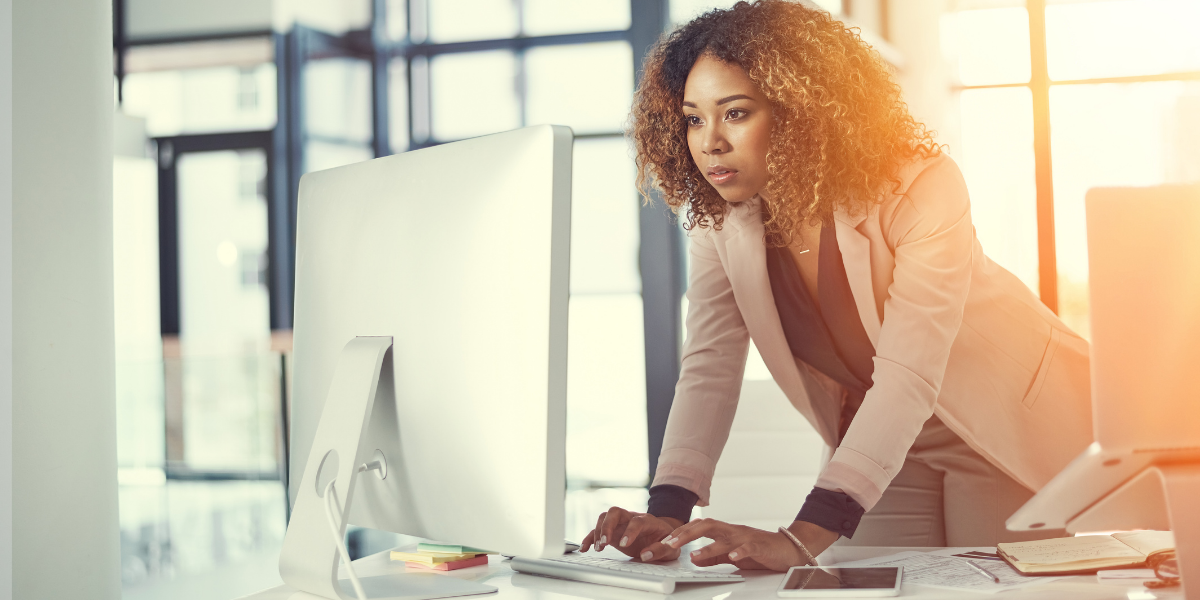 Women seriously working on her computer