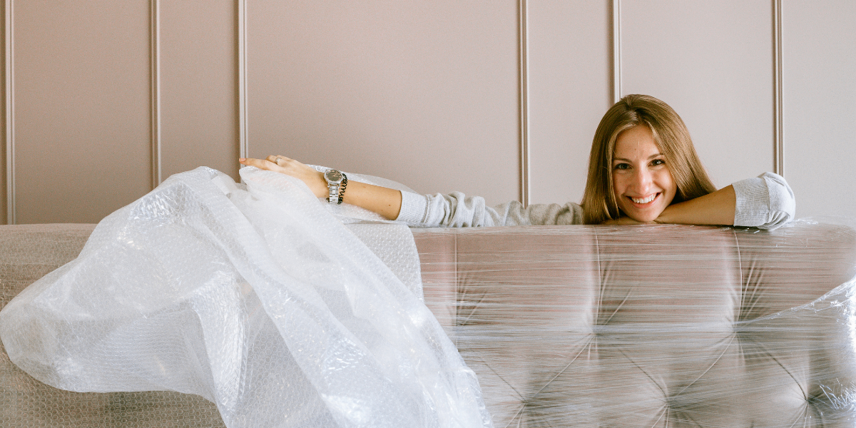 White female unwrapping new furniture 