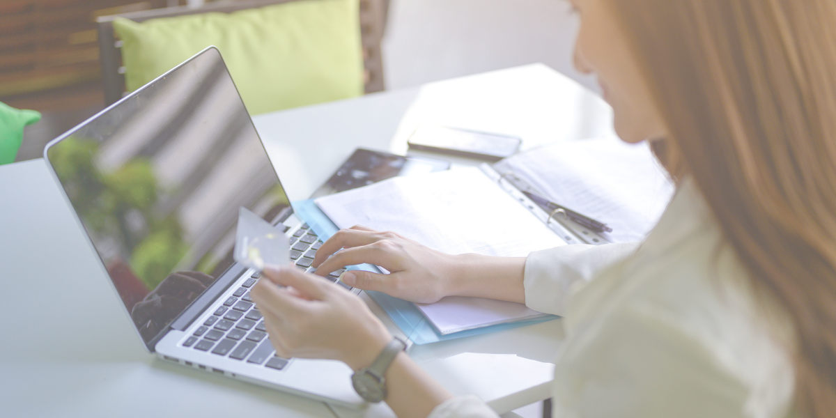 Women paying a bill on her laptop