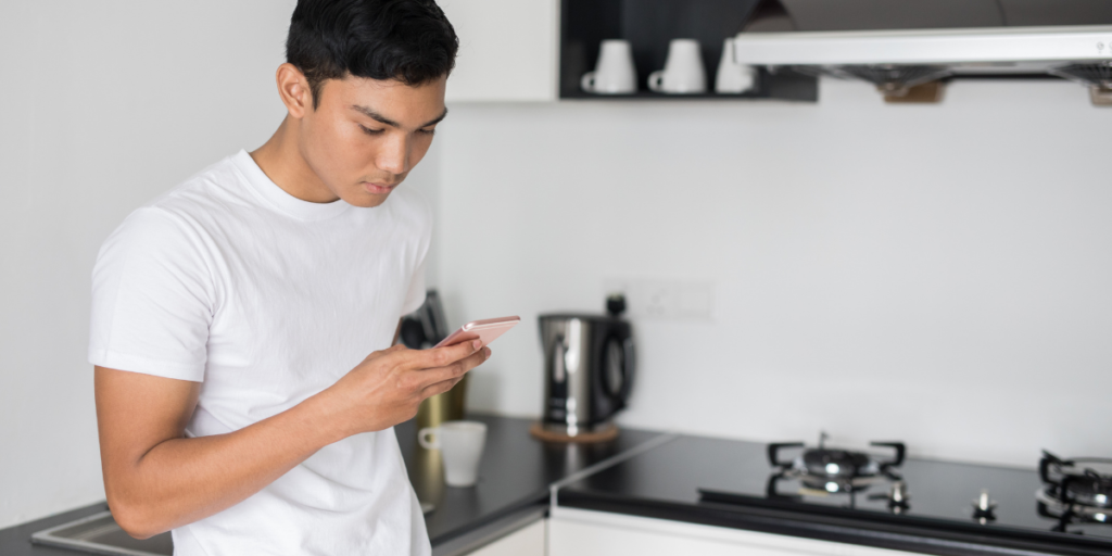 guy checking his email on his cellphone using free internet