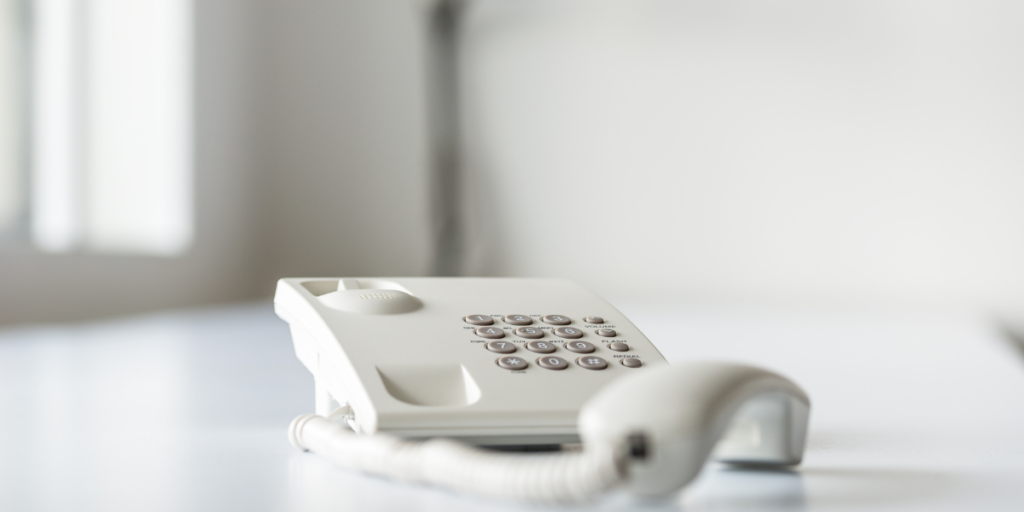 white landline home phone used for free internet