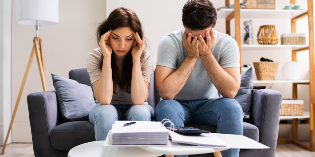 Couple stressing over finances and future needing to change their money mindset.