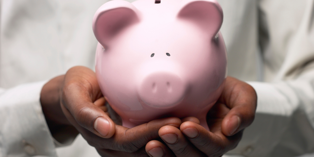 A little pink piggy bank waiting on its owner to change their money mindset and start adding money to it to secure their financial future. 