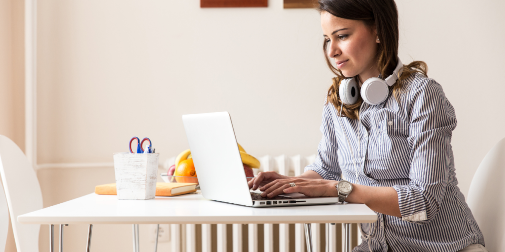 Female blogger working hard teaching others how to reach their financial goals. 