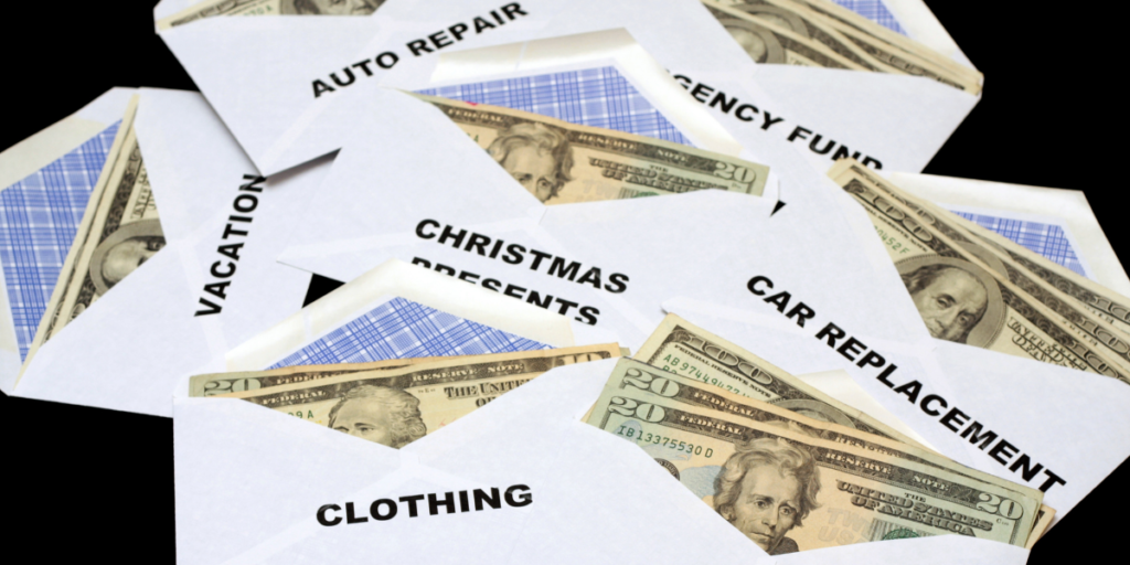 Several cash envelopes filled with money that someone is using to help them stick to their budget. 