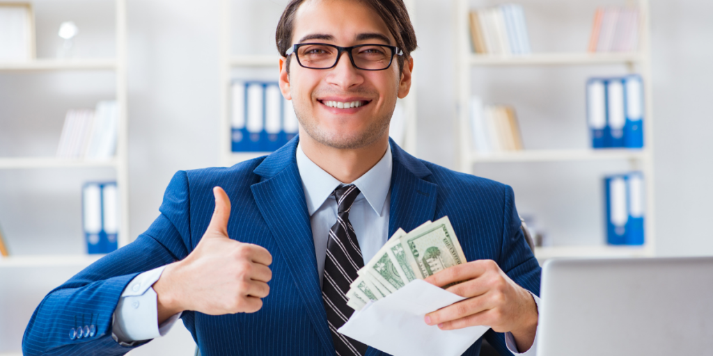 A guy holding an envelope with money he has saved to become an millionaire. 