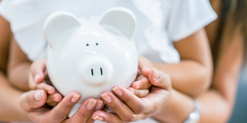 A woman and a small child holding a white piggy bank on their way to becoming a millionaire. 