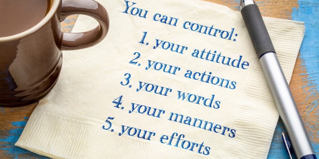 A cup of coffee next to a napkin on a table with a pen and the napkin has the words "You can control: your attitude, your actions, your words, your manners, your efforts" when it comes to reaching your financial goals. 