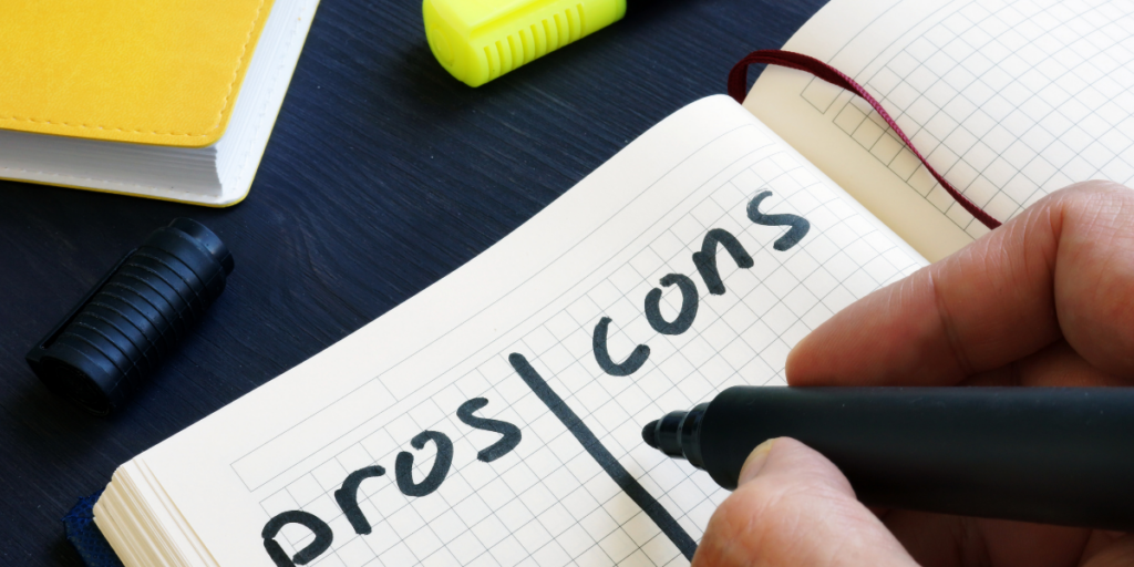 The start of a pros and cons list in a notebook.