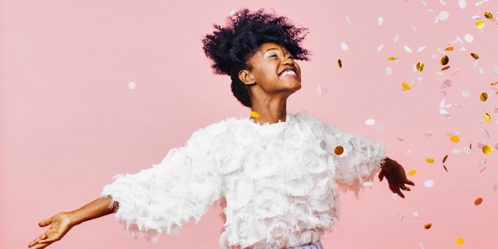 A young woman excited to learn about all the ways she can earn Amazon gift cards! 