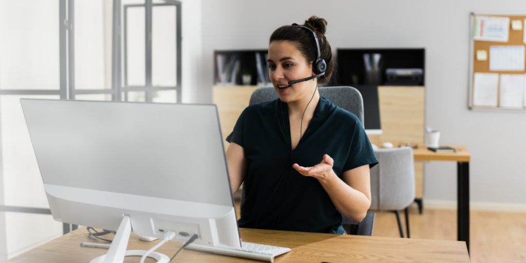 A lady sitting at her desk working part time as a Virtual Assistant for an organization is a great way to earn extra money during the summer or any other time for that matter. 