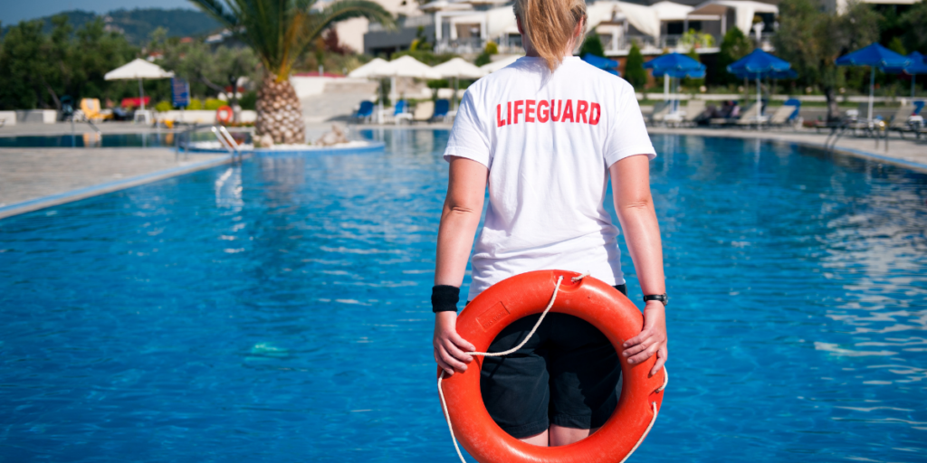 A lifeguard keeping an eye over the pool and earning extra money during the summer months. 