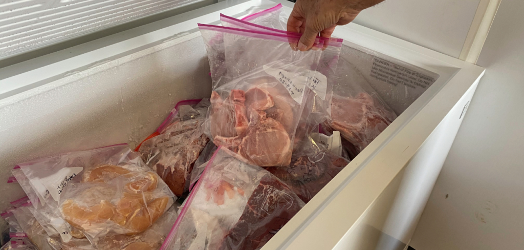 A deep freezer in a home for proportioned frozen meats and meals.
