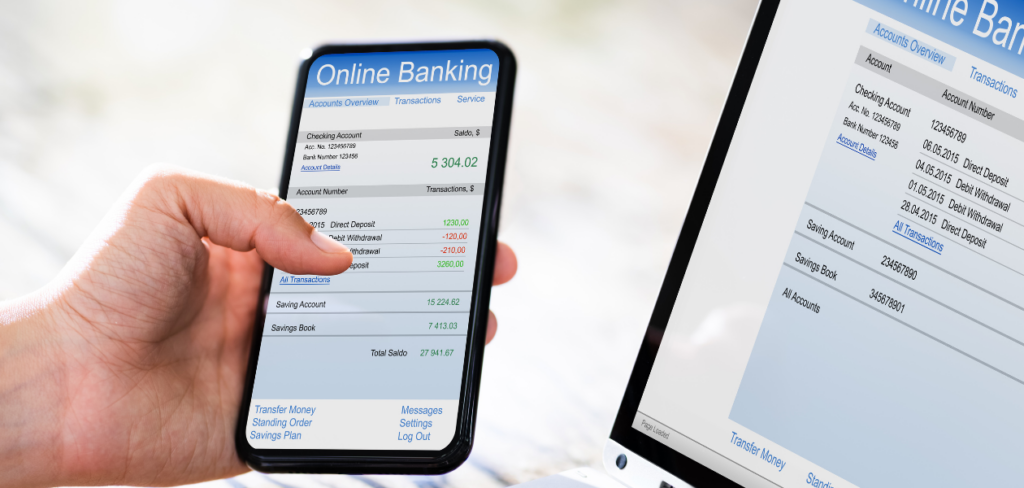 Online banking balance on mobile phone and laptop.