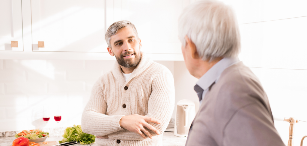 Two old roommates talking in the kitchen