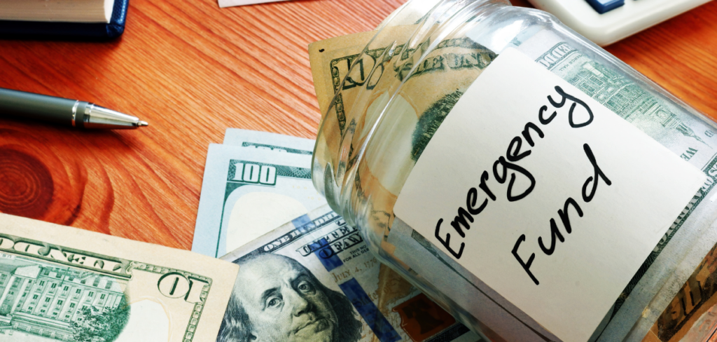 Emergency fund in the glass jar with cash.