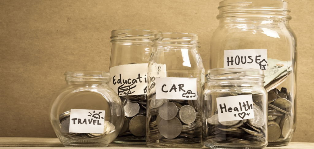 Money saved in glass jars with labels for travel, education, car, health, and house.