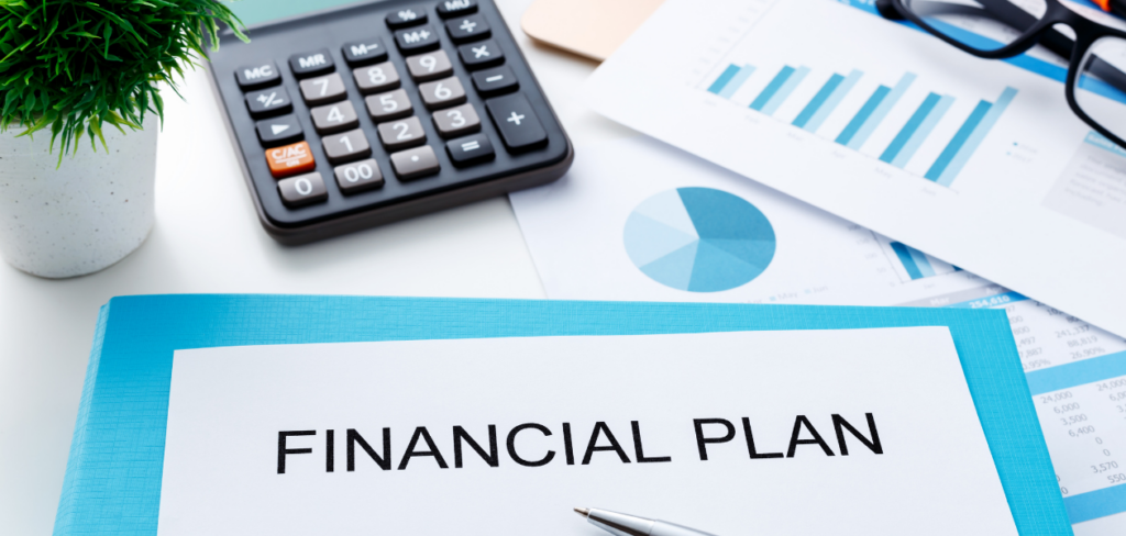Financial plan with calculator, glasses and financial chart.
