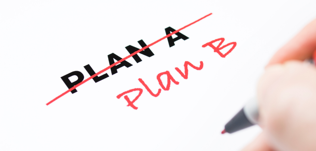 A hand writing showing a change from Plan A to Plan B.
