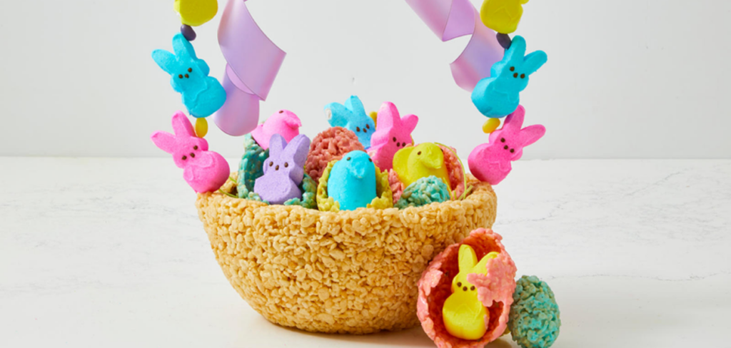 A colorful Easter basket made of rice crispy treats and candy peeps.