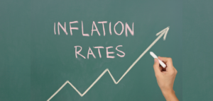 Inflation rates rising, drawn on chalkboard with an upward arrow.