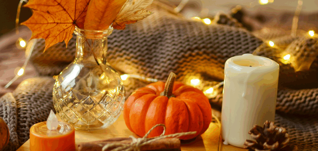 fall pumpkin and candle with twinkle lights